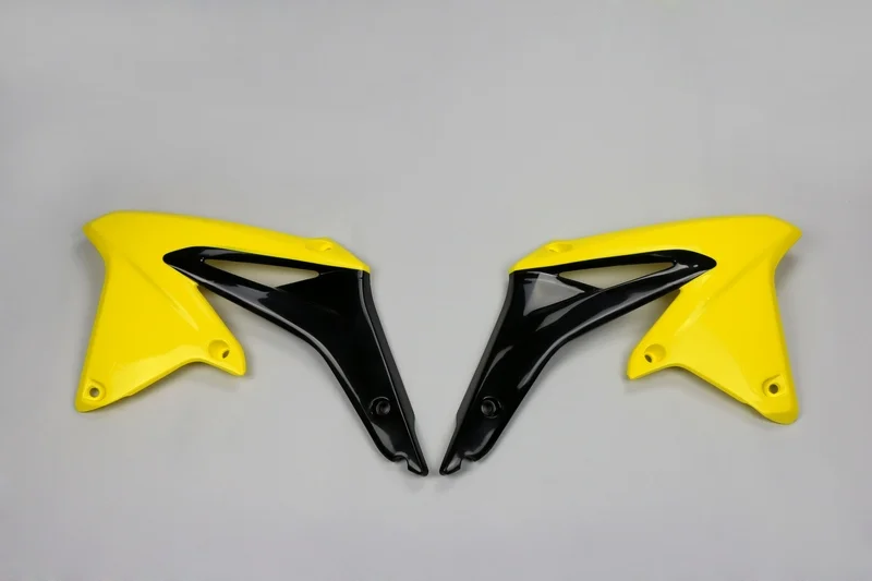 Plásticos laterales de radiador UFO Suzuki amarillo SU04927-102