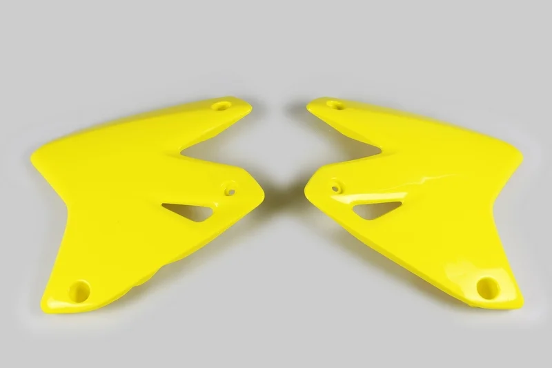 Plásticos laterales de radiador UFO Suzuki amarillo SU03978-102